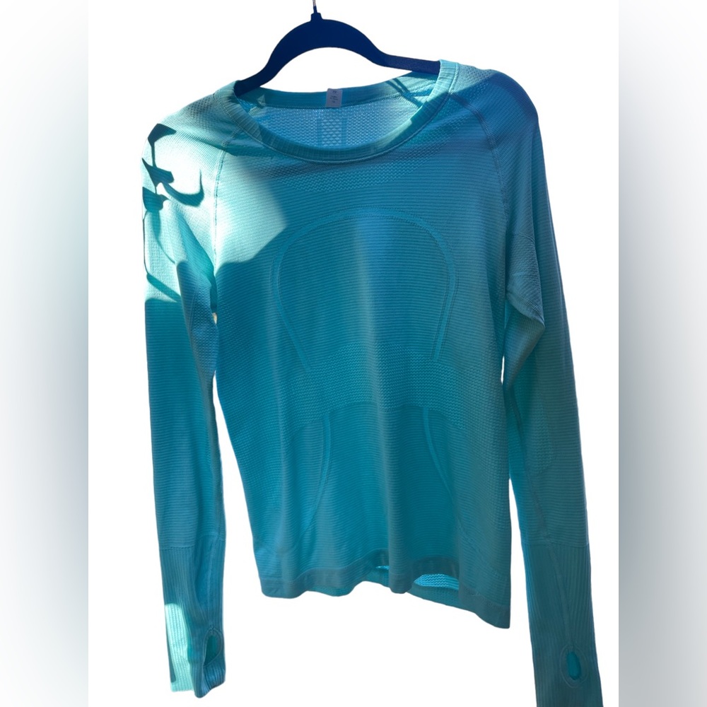 Lululemon Long Sleeve Top. Size 10. In good condition. Color is sky blue